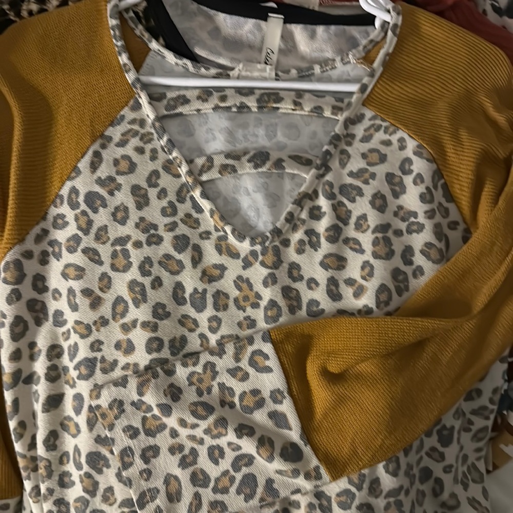 lovely melody leopard print top with cutout and mustardy yellow sleeves
